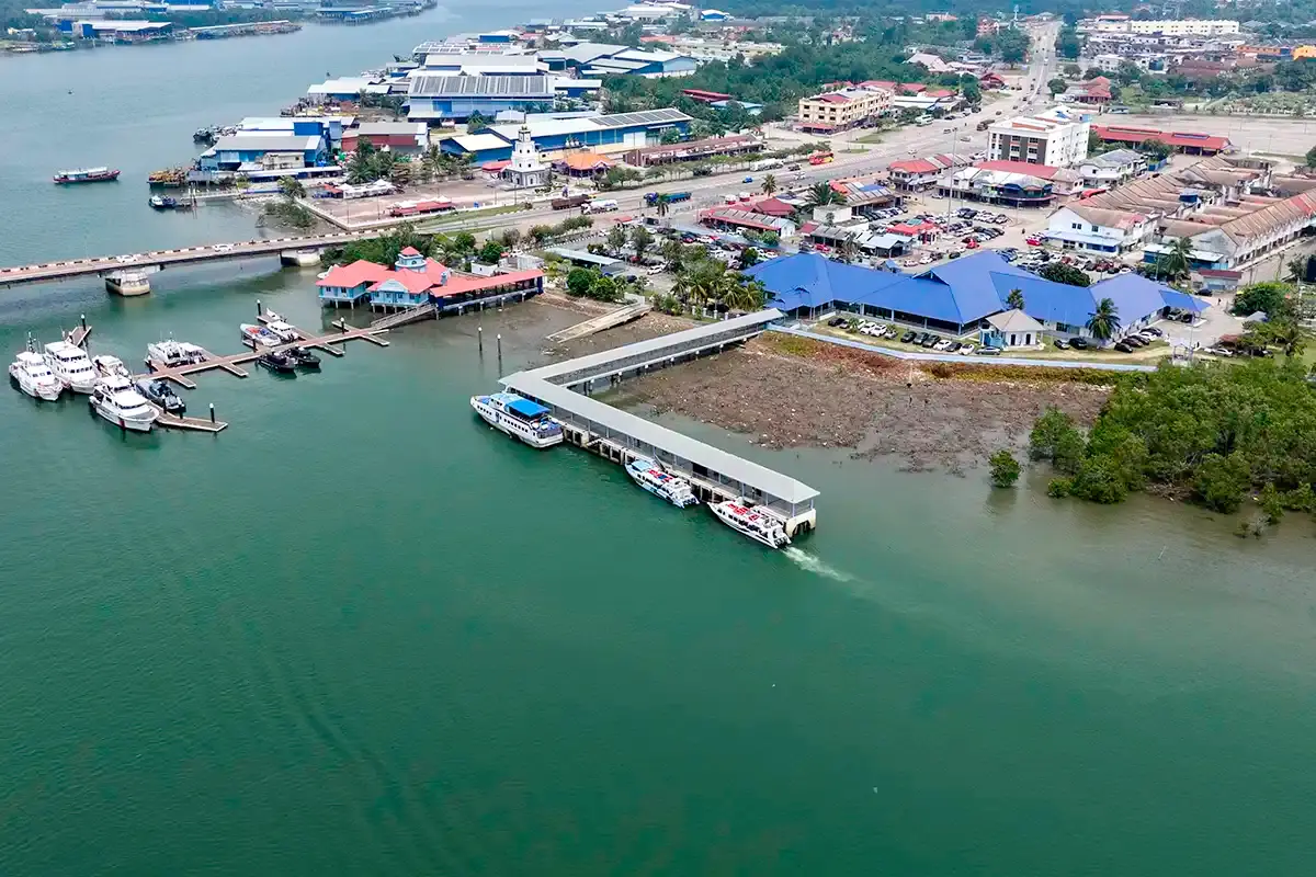 Aerial view of Tanjung Gemok Jetty with ferry boats, passenger terminal and waterfront in Pahang