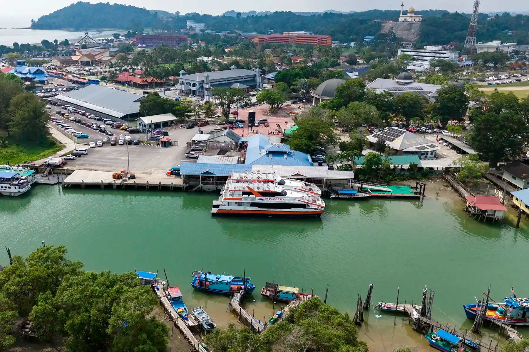 Aerial view of Mersing Jetty with a Cataferry vessel docked at the ferry terminal in Mersing, Johor