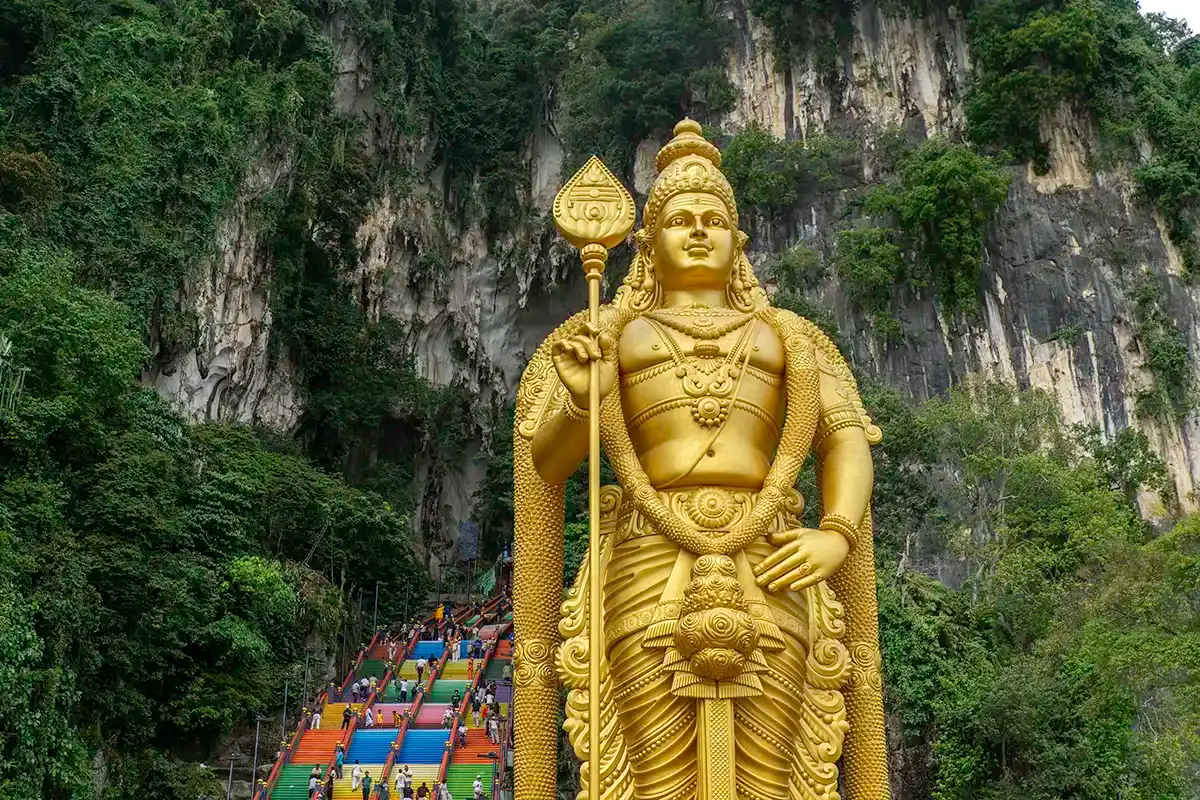 Golden Lord Murugan statue and colourful steps at Batu Caves, Selangor