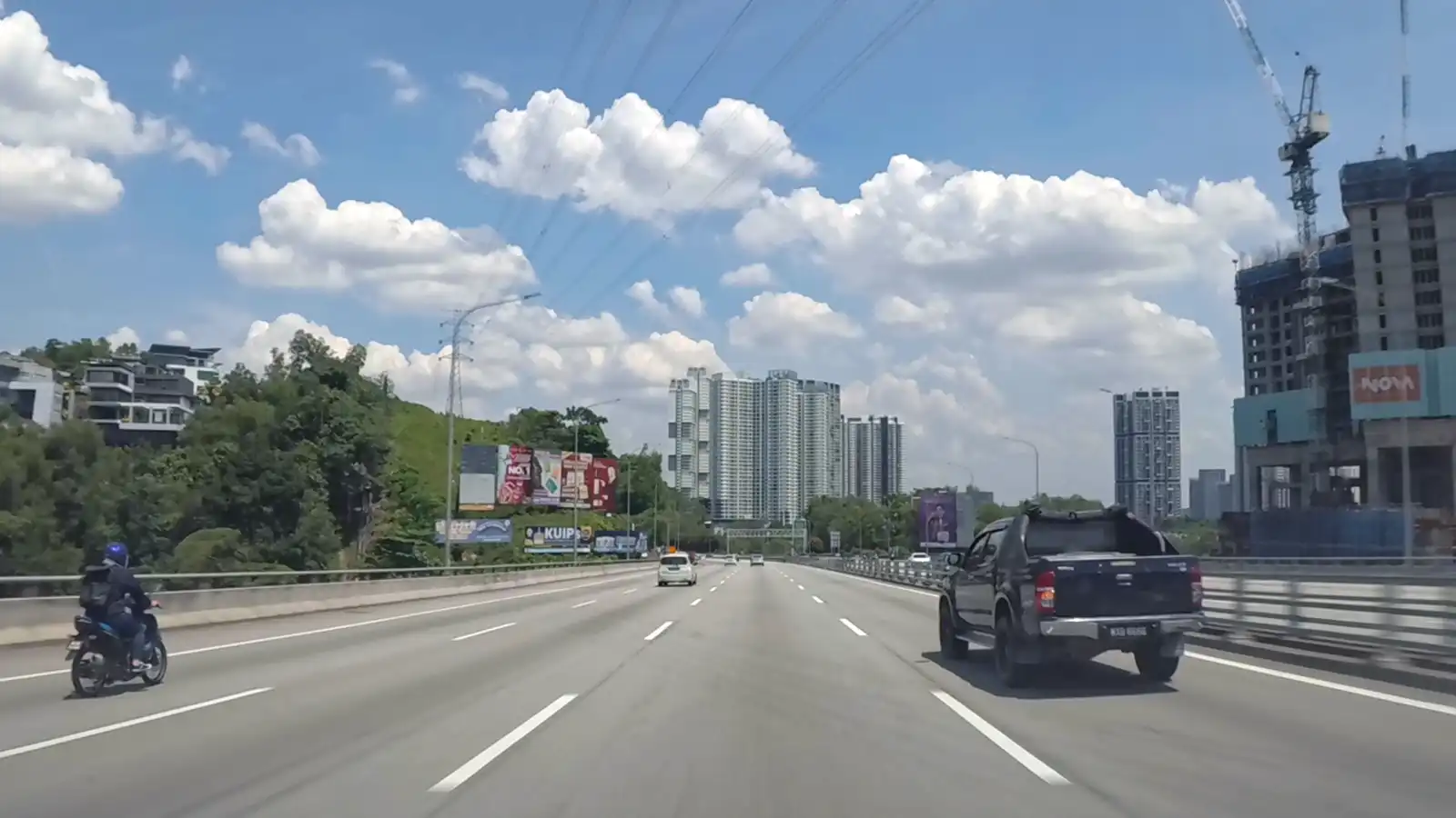 Private transfer Malaysia vehicle travelling on Kuala Lumpur highway for intercity journey