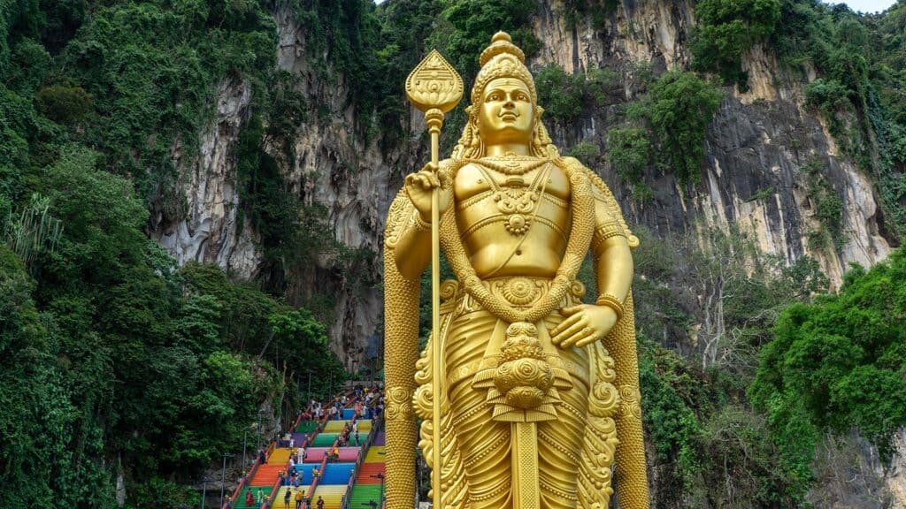 Batu Caves Murugan statue and rainbow steps — Kuala Lumpur to Taman Negara private transfer stopover